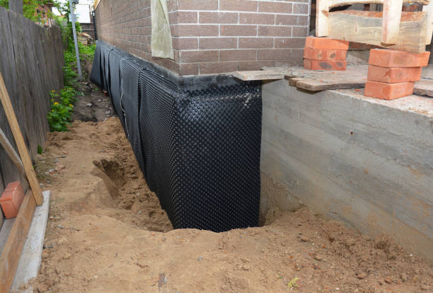 Happy homeowners after waterproofing job in Great Mills